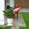 BRIGHT STANDING FLAMINGO LOOKING BACK